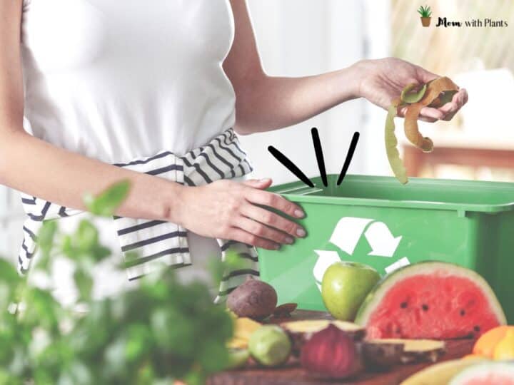 a woman placing food scraps into a kitchen compost bin